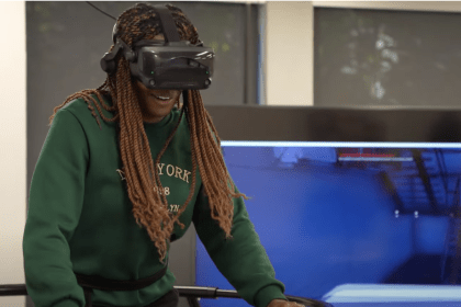 A student tries out a VR fitness game.